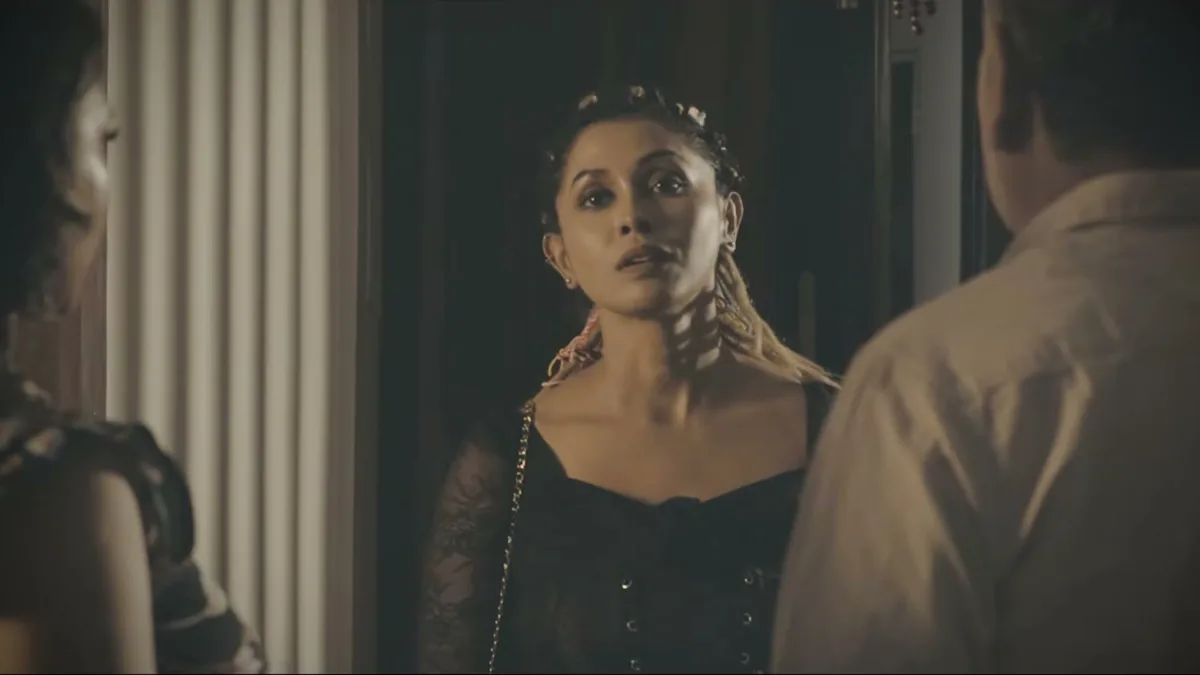 Two figures facing each other in a doorway, a still from TEH, The Layer